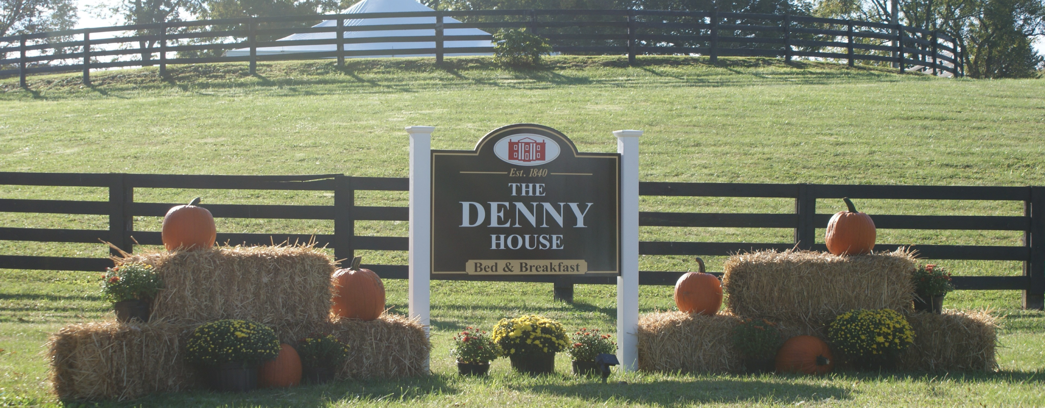 The Denny House sign by the road